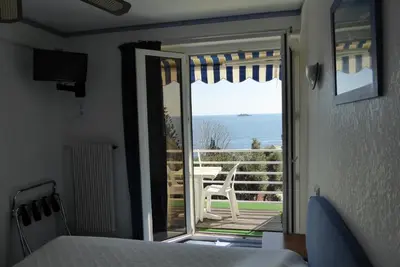 Un ou plusieurs lits dans un hébergement de l'établissement Hotel Cyrnea