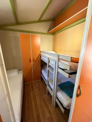 Un ou plusieurs lits dans un hébergement de l'établissement Le Camping de la Plage