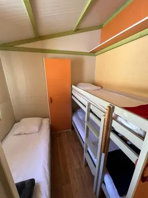 Un ou plusieurs lits dans un hébergement de l'établissement Le Camping de la Plage