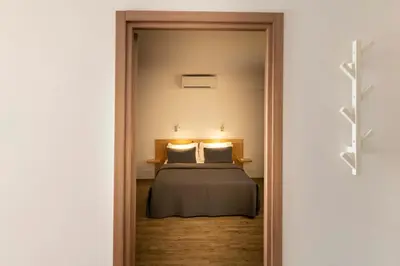 Un ou plusieurs lits dans un hébergement de l'établissement Suites in Erbalunga