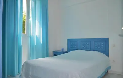 Un ou plusieurs lits dans un hébergement de l'établissement Cozy Apartment In Talasani