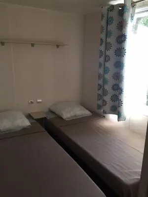 Un ou plusieurs lits dans un hébergement de l'établissement Camping Via Romana