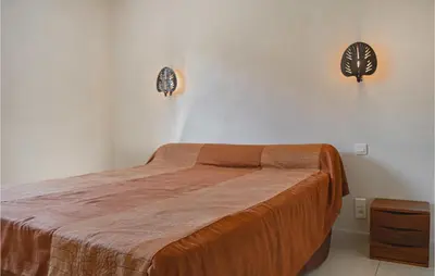 Un ou plusieurs lits dans un hébergement de l'établissement Cozy Home In Moriani Plage With Wifi