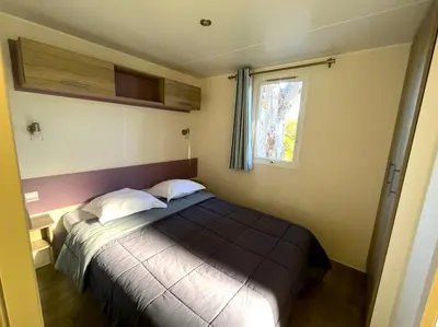 Un ou plusieurs lits dans un hébergement de l'établissement Camping Dolce Vita