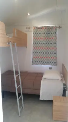 Un ou plusieurs lits dans un hébergement de l'établissement Camping Dolce Vita