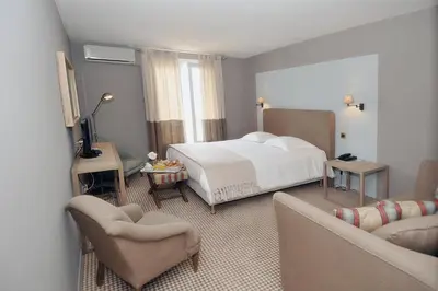Un ou plusieurs lits dans un hébergement de l'établissement Hotel Santa Maria