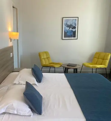 Un ou plusieurs lits dans un hébergement de l'établissement Grand Hôtel De Calvi