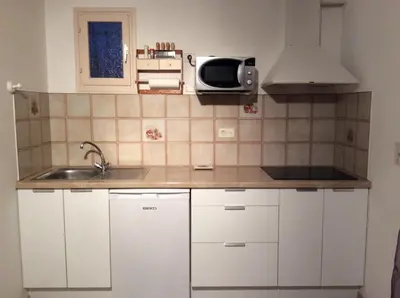 Cuisine ou kitchenette dans l'établissement Rez de Villa Vue Mer Panoramique