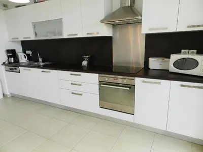 Cuisine ou kitchenette dans l'établissement Apartment Lup - Les terrasses d'Alistro by Interhome