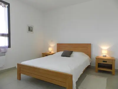 Un ou plusieurs lits dans un hébergement de l'établissement Apartment Lup - Les terrasses d'Alistro by Interhome