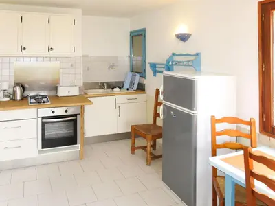 Cuisine ou kitchenette dans l'établissement Apartment Résidence Posidonie Bodri - Pigna by Interhome