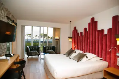 Télévision ou salle de divertissement dans l'établissement Hotel Onda