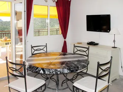 Télévision ou salle de divertissement dans l'établissement Apartment Aloes by Interhome