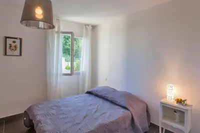 Un ou plusieurs lits dans un hébergement de l'établissement Villa Jardins de la Mer