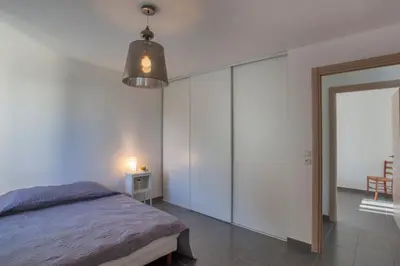 Un ou plusieurs lits dans un hébergement de l'établissement Villa Jardins de la Mer