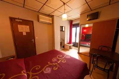 Un ou plusieurs lits dans un hébergement de l'établissement Hotel & Restaurant Le Beau Sejour