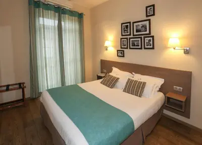 Un ou plusieurs lits dans un hébergement de l'établissement Hôtel Duc De Padoue
