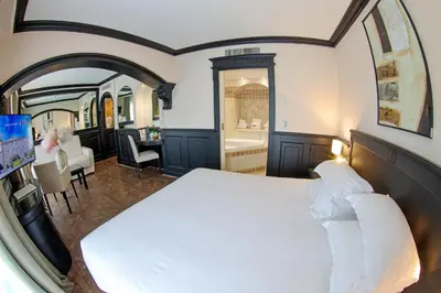 Un ou plusieurs lits dans un hébergement de l'établissement Hôtel L'Abbaye
