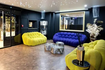Coin salon dans l'établissement Hôtel L'Abbaye
