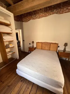 Un ou plusieurs lits dans un hébergement de l'établissement Appartement L'Ile-Rousse