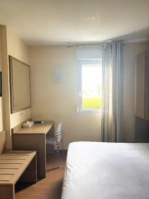 Un ou plusieurs lits dans un hébergement de l'établissement Hôtel Thalassa