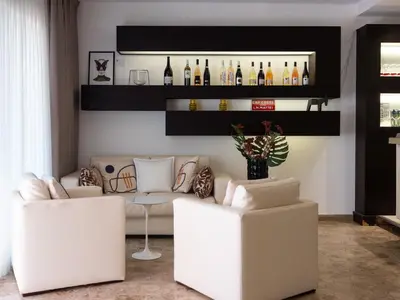 Coin salon dans l'établissement Hotel Revellata & Spa