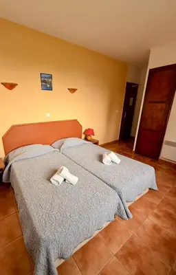 Un ou plusieurs lits dans un hébergement de l'établissement Hôtel - Pub Le Petit Bosquet