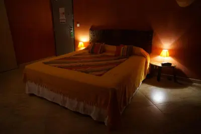 Un ou plusieurs lits dans un hébergement de l'établissement Hotel Le Saint Jean