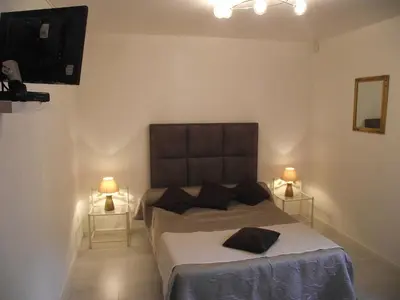 Un ou plusieurs lits dans un hébergement de l'établissement Villa Emmony