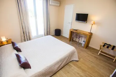 Un ou plusieurs lits dans un hébergement de l'établissement Hotel Cesario