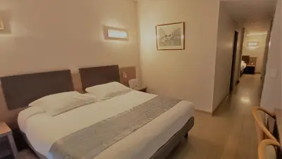 Un ou plusieurs lits dans un hébergement de l'établissement Hotel Poretta