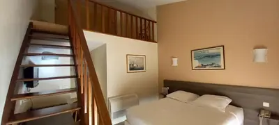 Un ou plusieurs lits dans un hébergement de l'établissement Hotel Poretta