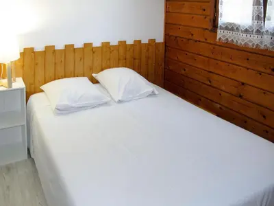 Un ou plusieurs lits dans un hébergement de l'établissement Holiday Home Chalet 2 pers by Interhome