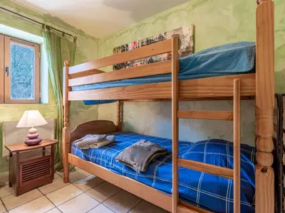 Un ou plusieurs lits dans un hébergement de l'établissement Holiday Home Migone de Sampolo by Interhome