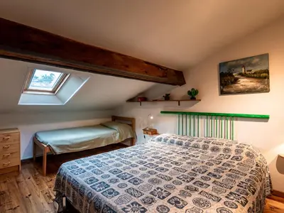 Un ou plusieurs lits dans un hébergement de l'établissement Apartment Villa Volpajola by Interhome