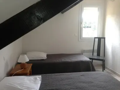 Un ou plusieurs lits dans un hébergement de l'établissement Villa Romarin