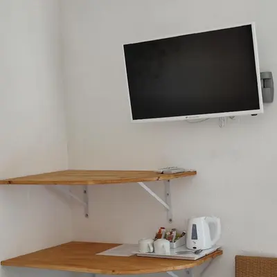 Télévision ou salle de divertissement dans l'établissement Le monte rosso