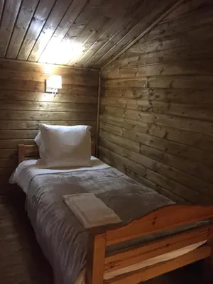 Un ou plusieurs lits dans un hébergement de l'établissement Gîtes les Chalets Vezzani Spa