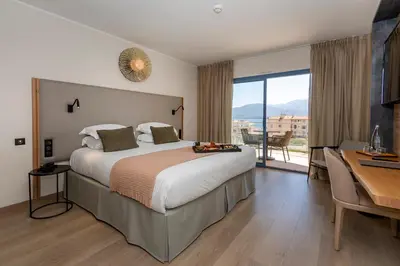 Un ou plusieurs lits dans un hébergement de l'établissement Hotel L'Acquale