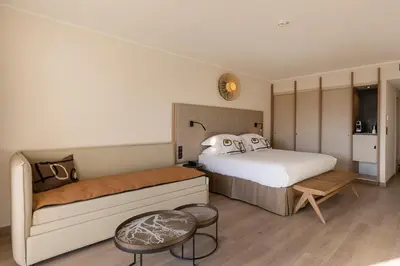 Un ou plusieurs lits dans un hébergement de l'établissement Hotel L'Acquale