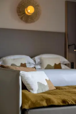 Un ou plusieurs lits dans un hébergement de l'établissement Hotel L'Acquale