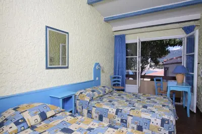 Un ou plusieurs lits dans un hébergement de l'établissement Hotel L'ondine
