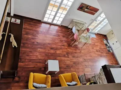 Coin salon dans l'établissement Appartement Vue Mer à Bastia, terrasse et piscine privée.