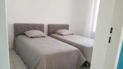 Un ou plusieurs lits dans un hébergement de l'établissement Appartement 2 terrasses face mer de 100m2