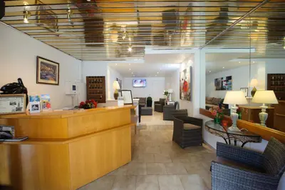 Coin salon dans l'établissement Hotel et Résidence Cala di sole