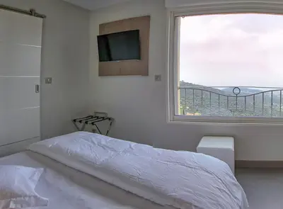 Un ou plusieurs lits dans un hébergement de l'établissement Hotel La Santa