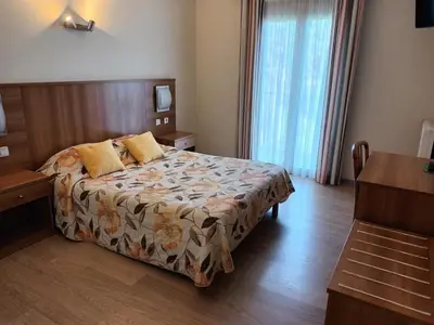 Un ou plusieurs lits dans un hébergement de l'établissement Hotel de La Paix