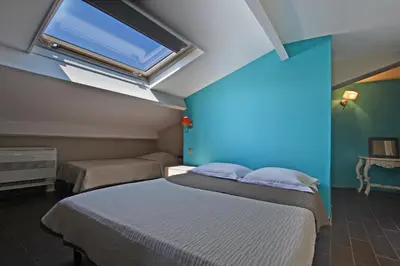 Un ou plusieurs lits dans un hébergement de l'établissement Hôtel la Palma