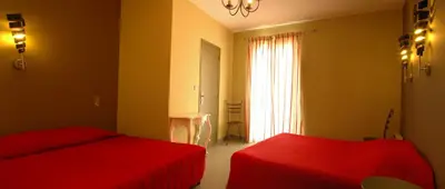 Un ou plusieurs lits dans un hébergement de l'établissement Hôtel la Palma