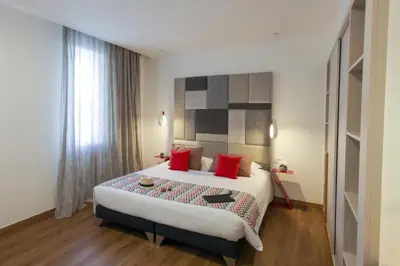 Un ou plusieurs lits dans un hébergement de l'établissement Hôtel Méditerranée